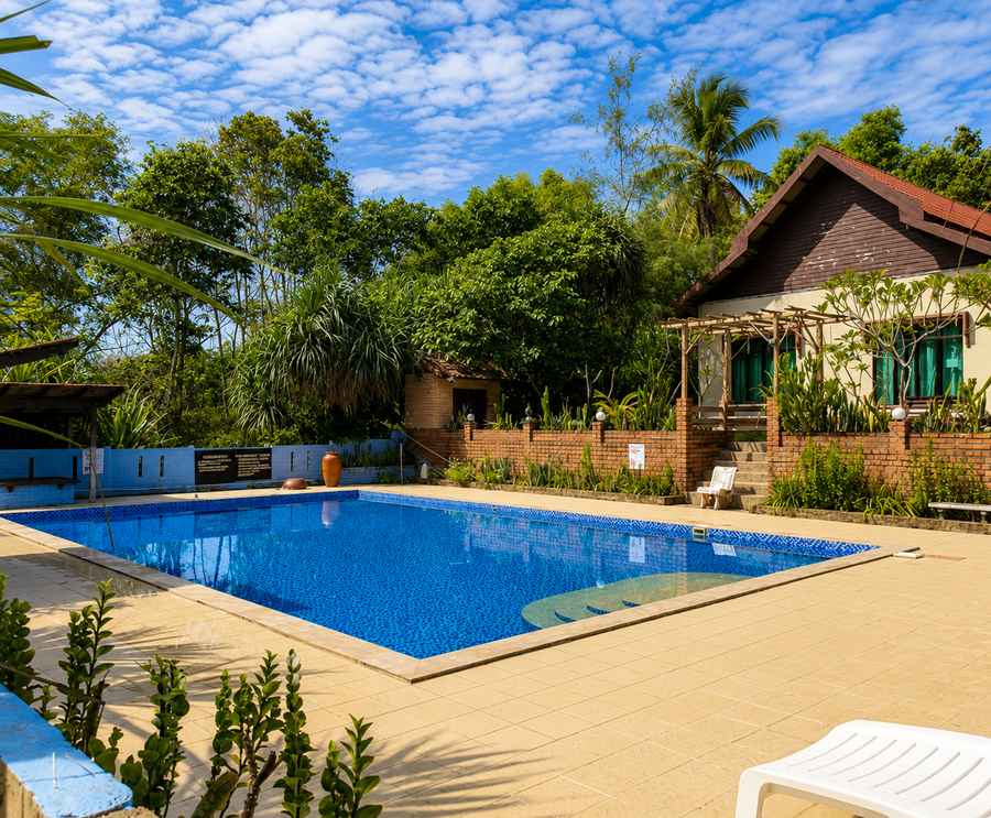 Outdoor swimming pool by the sea at the resort